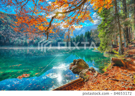Breathtaking view of Fusine lake with Mangart peak on background Breathtaking view of Fusine lake with Mangart peak on background 84653172