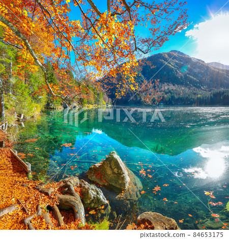 Fabulous view of sunset over Fusine lake with Mangart peak on background. Fabulous view of sunset over Fusine lake with Mangart peak on background. 84653175