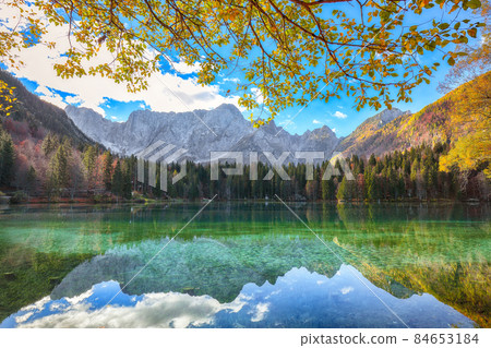Fairytale  view of Fusine lake with Mangart peak on background 84653184