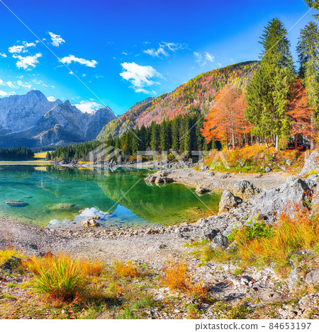 Fantastic view of Fusine lake with Mangart peak on background Fantastic view of Fusine lake with Mangart peak on background 84653197