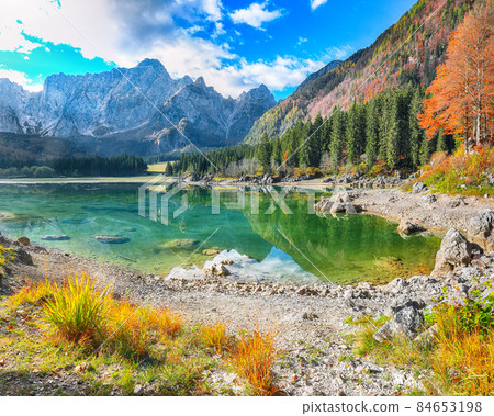 Fantastic view of Fusine lake with Mangart peak on background Fantastic view of Fusine lake with Mangart peak on background 84653198