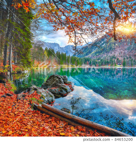 Fabulous view of sunset over Fusine lake with Mangart peak on background. 84653200