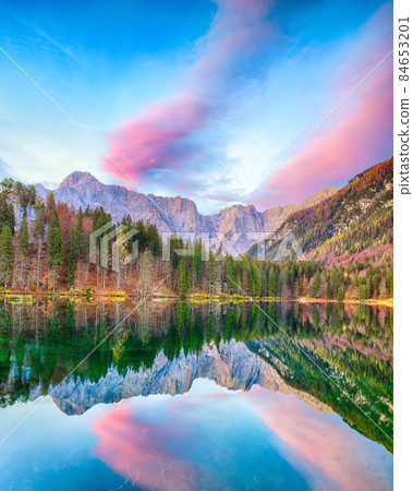 Breathtaking view of sunset over Fusine lake with Mangart peak on background. 84653201