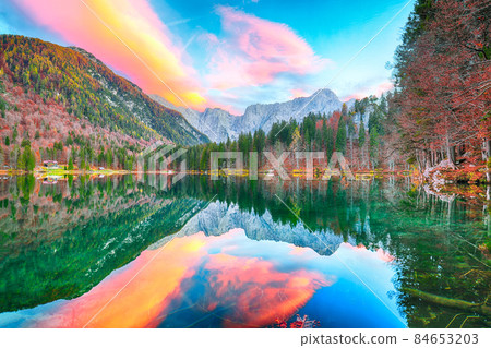 Astonishing view of Fusine lake with Mangart peak on background. Astonishing view of Fusine lake with Mangart peak on background. 84653203