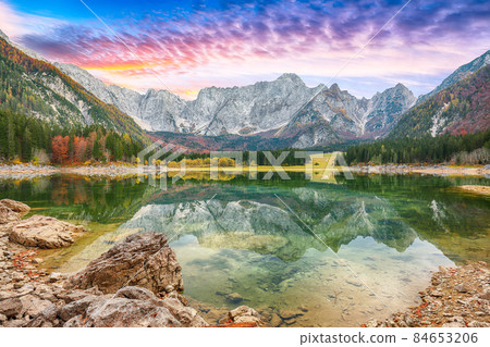 Astonishing view of Fusine lake with Mangart peak on background. Astonishing view of Fusine lake with Mangart peak on background. 84653206