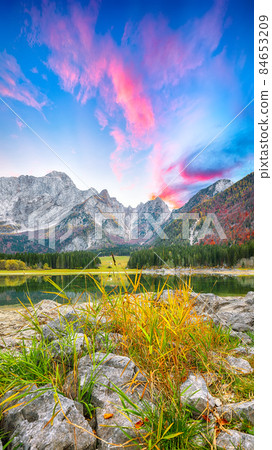 Astonishing view of Fusine lake with Mangart peak on background. 84653209