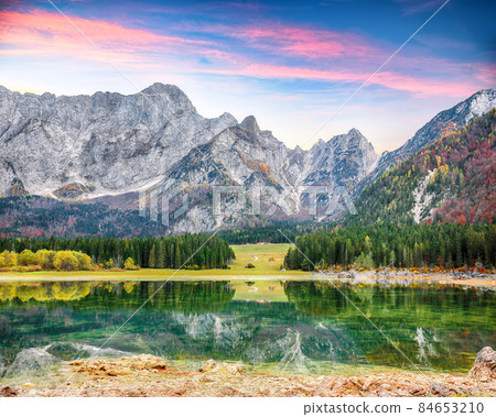 Astonishing view of Fusine lake with Mangart peak on background. Astonishing view of Fusine lake with Mangart peak on background. 84653210