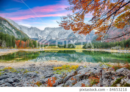 Astonishing view of Fusine lake with Mangart peak on background. Astonishing view of Fusine lake with Mangart peak on background. 84653218