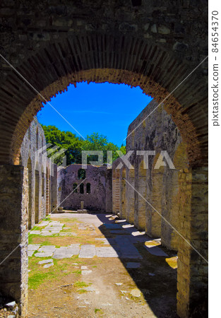 Panoramic view to ruins of The Basilica in Butrint ancient town , Sarande, Albania Panoramic view to ruins of The Basilica in Butrint ancient town , Sarande, Albania 84654370
