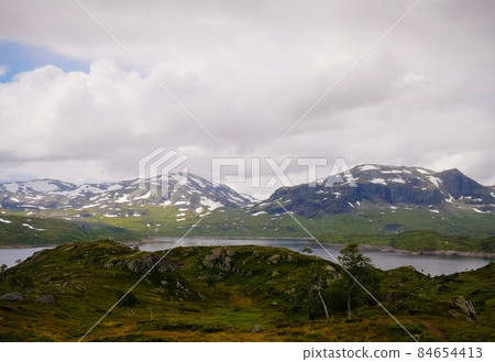 Panoramic view to Hardangervidda plateau and Votna lake at Norway Panoramic view to Hardangervidda plateau and Votna lake at Norway 84654413