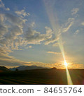 An auspicious sun dog facing the tea plantation and a powerful sunset 84655764