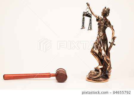 Justilia or Themis statue ang gavel isolated on white background with clipping path 84655792