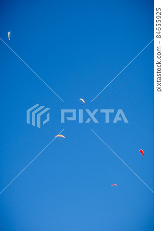 paragliding flight in the mountains. Le Grand-Bornand, France 84655925
