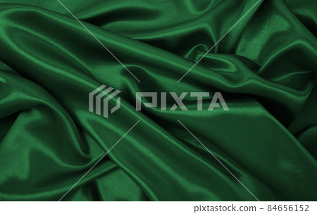 Smooth elegant green silk or satin luxury cloth texture as abstract background. Luxurious background design Smooth elegant green silk or satin luxury cloth texture as abstract background. Luxurious background design 84656152