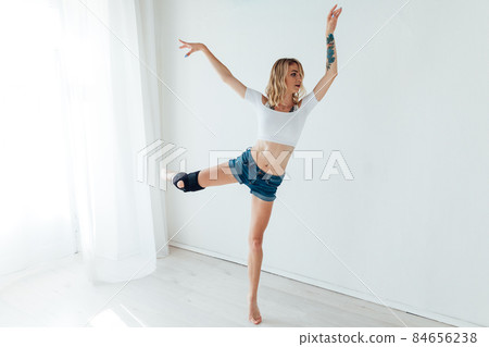 athletic woman blonde dancing to music alone athletic woman blonde dancing to music alone 84656238