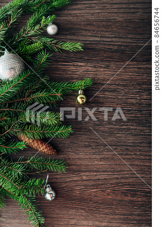 Christmas Tree Branches on a Brown Background with CopySpace for Text 84656744