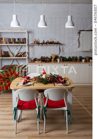 Beautiful table setting with Christmas decor in living room. Beautiful table setting with Christmas decor in living room. 84656807