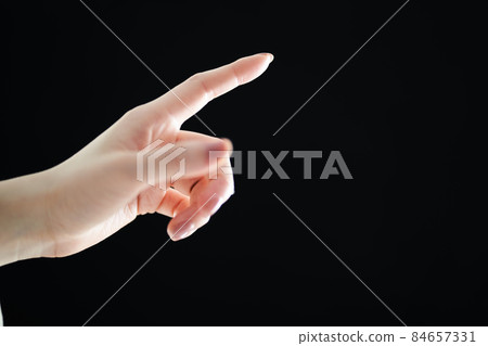 Close-up of the hand of a woman pointing Close-up of the hand of a woman pointing 84657331