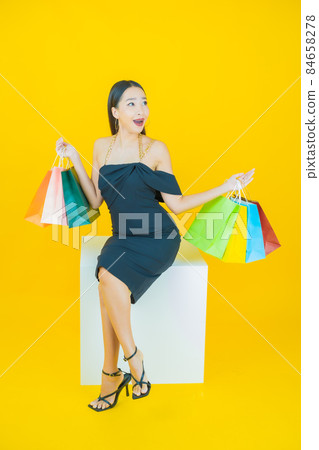 Portrait beautiful young asian woman smile with shopping bag Portrait beautiful young asian woman smile with shopping bag 84658278