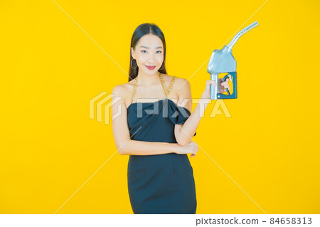 Portrait beautiful young asian woman feul gas pump 84658313