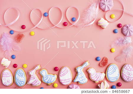 Homemade Easter cookies on pink background flat top view 84658667