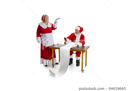 Emotional Santa Claus and his wife, missis Claus congrats with New Year and Christmas, writing a letter, wish list Emotional Santa Claus and his wife, missis Claus congrats with New Year and Christmas, writing a letter, wish list 84659665
