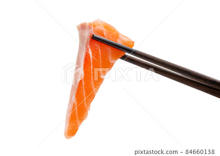 sliced raw salmon in chopsticks isolated on white background, clipping paths 84660138