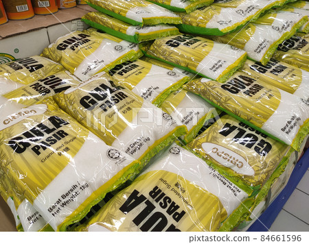 SELANGOR, MALAYSIA -JUNE 12, 2021: Selected focused on white sugar in commercial packaging is on display for sale in supermarkets. Sorted by brand and price tagged. SELANGOR, MALAYSIA -JUNE 12, 2021: Selected focused on white sugar in commercial packaging is on display for sale in supermarkets. Sorted by brand and price tagged. 84661596