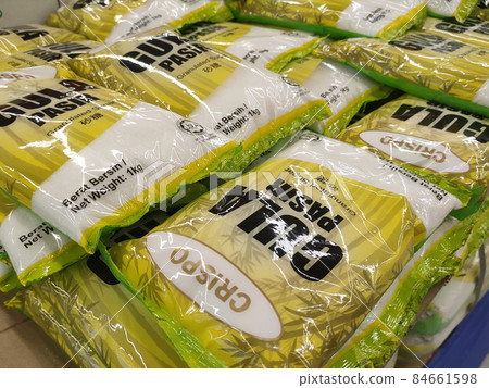 SELANGOR, MALAYSIA -JUNE 12, 2021: Selected focused on white sugar in commercial packaging is on display for sale in supermarkets. Sorted by brand and price tagged. SELANGOR, MALAYSIA -JUNE 12, 2021: Selected focused on white sugar in commercial packaging is on display for sale in supermarkets. Sorted by brand and price tagged. 84661598