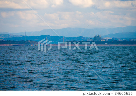 Shooting from the sea overlooking the Uchinada of the Sunset Bridge in the distance 84665635