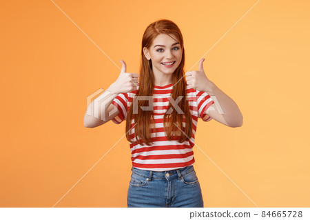 Good work, keep going. Girl encourage friend, say well done, show satisfactory sign, thumbs-up and smiling pleased, agree, approve nice choice, accept point view, stand orange background Good work, keep going. Girl encourage friend, say well done, show satisfactory sign, thumbs-up and smiling pleased, agree, approve nice choice, accept point view, stand orange background 84665728