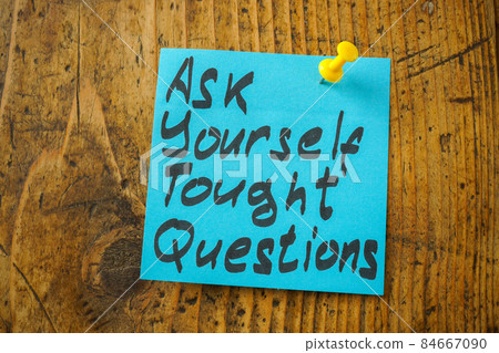 Pinned sticker with an inscription ask yourself tough questions. 84667090