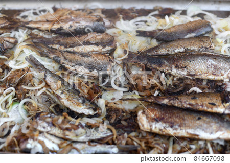 Herring on a grill on the market 84667098