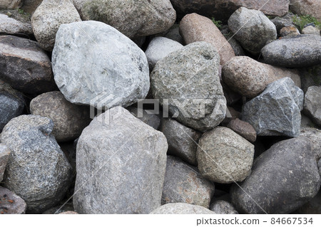 Rockfall on the road in the mountains. Stones of different sizes. Landslides. Rockfall on the road in the mountains. Stones of different sizes. Landslides. 84667534