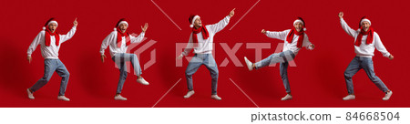 Set Of Joyful Young Man In Santa Hat Dancing Over Red Background 84668504