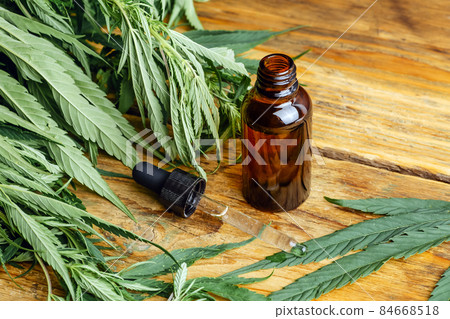 Cannabis oil cannabidiol cbd. Medical cannabis marijuana and extract on wooden background. 84668518