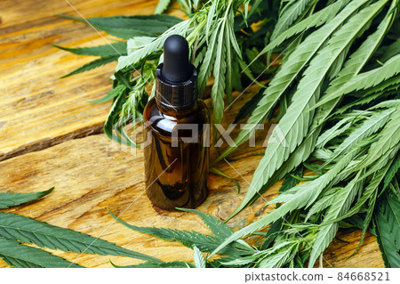 Cannabis oil cannabidiol cbd. Medical cannabis marijuana and extract on wooden background. 84668521