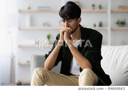 Stressed middle eastern young man suffering from crisis while pandemic 84668663