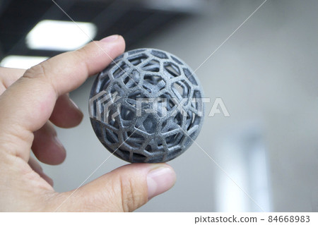 Man holds in hand model printed on 3D printer. Multi Jet Fusion MJF 3D printing Man holds in hand model printed on 3D printer. Multi Jet Fusion MJF 3D printing 84668983