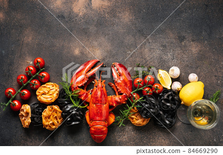 Food background with lobster and pasta Food background with lobster and pasta 84669290