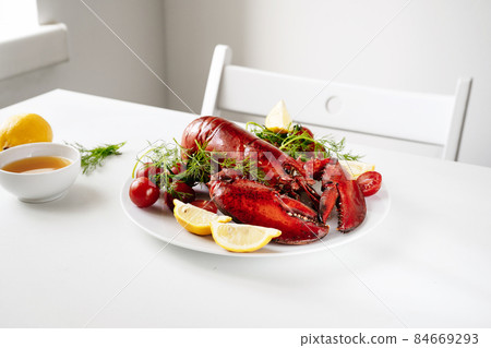 Freshly cookeed lobster in a plate Freshly cookeed lobster in a plate 84669293