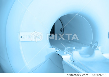 Medical CT or MRI Scan in the modern hospital laboratory. Interior of radiography department. Technologically advanced equipment in white room. Magnetic resonance diagnostics machine. Medical CT or MRI Scan in the modern hospital laboratory. Interior of radiography department. Technologically advanced equipment in white room. Magnetic resonance diagnostics machine. 84669738
