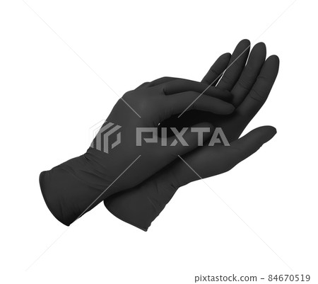 Medical gloves. Two black surgical gloves isolated on white background with hands. Rubber glove manufacturing, human hand is wearing a latex glove. Doctor or nurse putting on protective gloves. Medical gloves. Two black surgical gloves isolated on white background with hands. Rubber glove manufacturing, human hand is wearing a latex glove. Doctor or nurse putting on protective gloves. 84670519