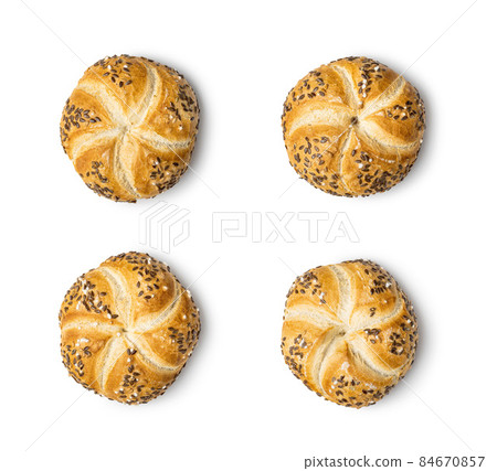 Four baked french buns with seeds 84670857