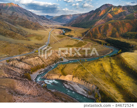 Chuya River in the Kurai Steppe, Altai Mountains, Siberia, Russia. Aerial view from a drone. Chuya River in the Kurai Steppe, Altai Mountains, Siberia, Russia. Aerial view from a drone. 84672524