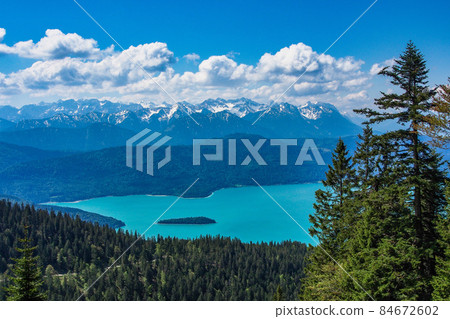 View from top of the Jochberg to the lake Walchensee and the Bavarian and Tyrolean mountains, Alps, Bavaria, Germany 84672602