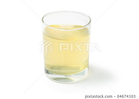 Closeup glass of Mitragyna speciosa Korth tea (Kratom) isolated on white background Closeup glass of Mitragyna speciosa Korth tea (Kratom) isolated on white background 84674103