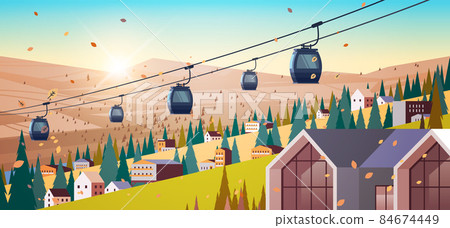 cableway in mountains residential houses area ski resort in autumn season sunset landscape background 84674449