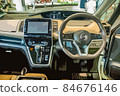 Minivan driver's seat, steering wheel and dashboard 84676146