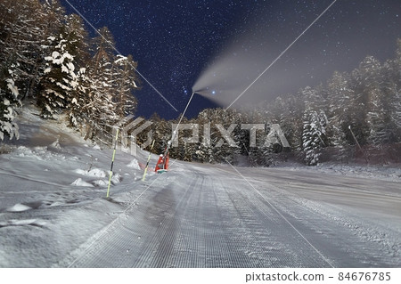 Ski slopes at night under the stars in the sky 84676785
